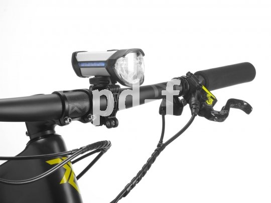 Eine Fahrradlampe am Lenker eines Fahrrads.